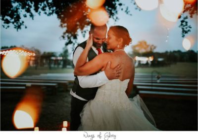 Bride and groom dancing at sunset