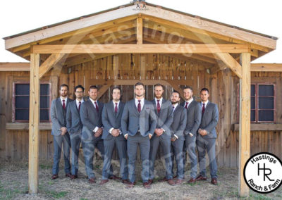 Groom and groomsmen dressed in suits for wedding