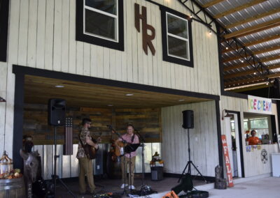 Musicians on the Hasting Ranch stage at the 2023 Farm Festival